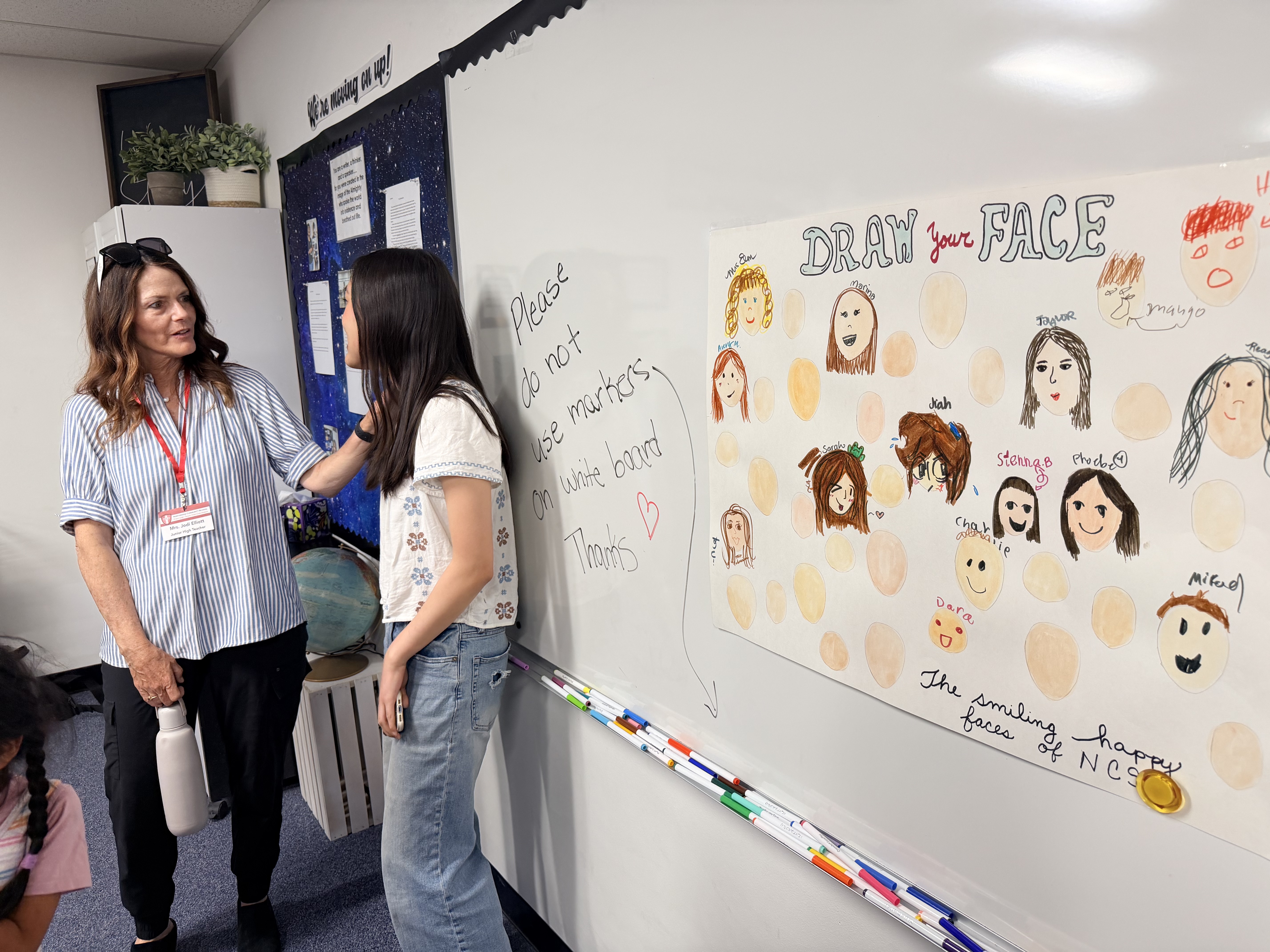 NCS teacher and parent in classroom